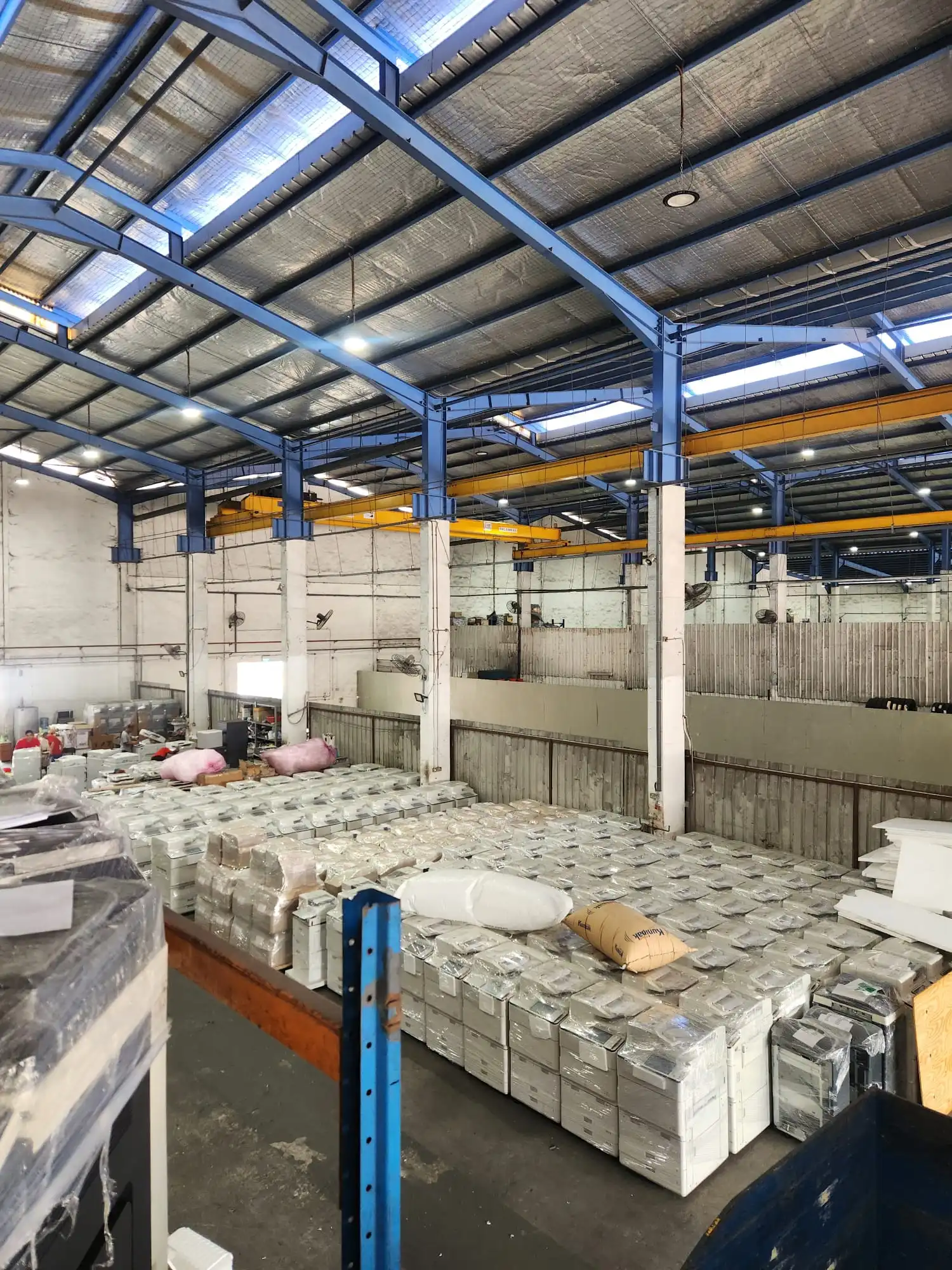 Rows of pre-used copiers in the TLS warehouse